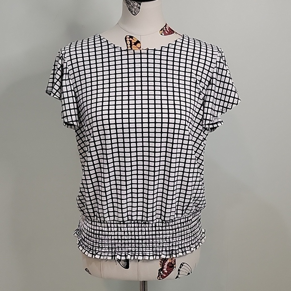 ADRIANNA PAPELL checked black and cream top with butterfly sleeves. Size is Med.